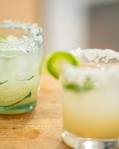 Two margaritas with lime