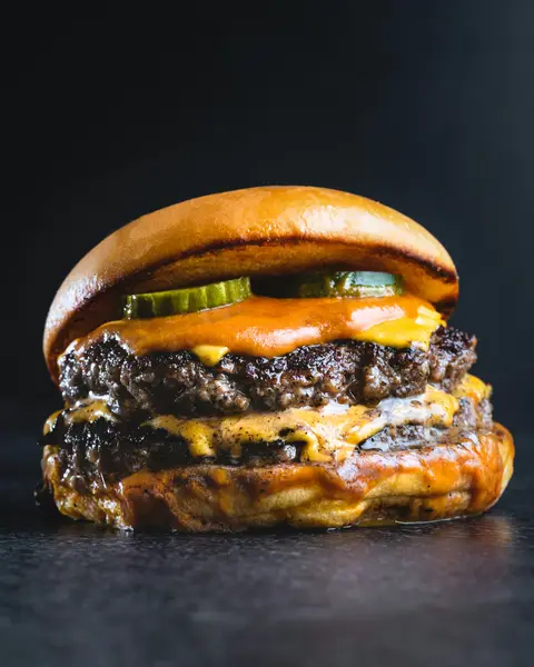 Double cheeseburger with melted cheese